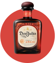 a bottle of donjujo tequila on a red background